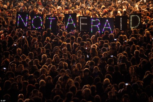 Protesters hold a vigil in Paris in the wake of the Charlie Hebdo attacks, January 7, 2015